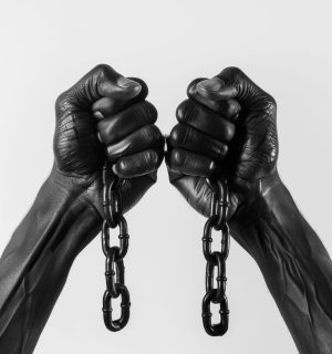 A pair of black hands breaking chains, symbolizing freedom and the hope for viewers to break free from their own struggles, isolated on a white background, in the style of hyper realistic photography, stock photo, professional color grading, soft shadows, clean sharp focus, high resolution photography, HDR, crisp details. --ar 2:3 Job ID: 430ef2a0-0ea5-41ac-96b2-2d3bbb6d3227